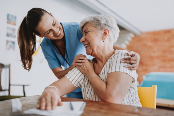 Home care healthcare professional hugging senior patient Home care healthcare professional hugging senior patient